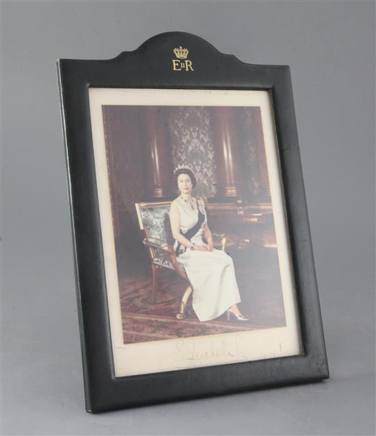 A signed colour photograph of HM Queen Elizabeth II, overall height 12.5in.